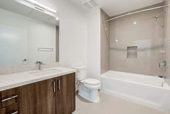a bathroom with a sink toilet and a bath tub